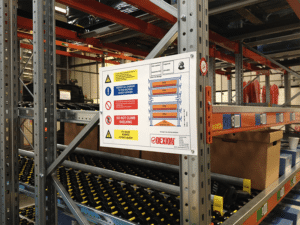 A photo of a racking load notice sign attached to a racking installation