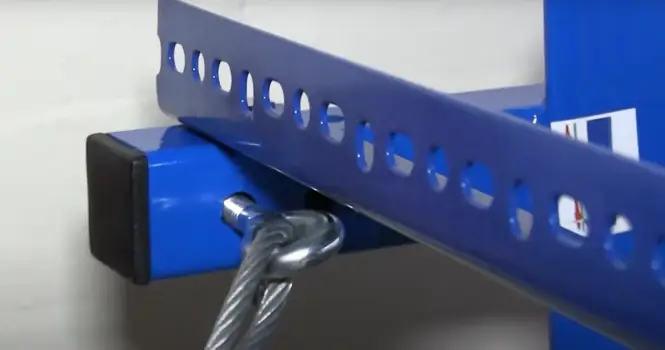 Photo showing the eye bolt being threaded through the first main bracket.